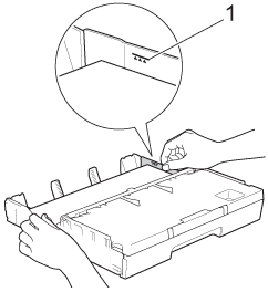 Check that the paper is flat in the tray and below the maximum paper mark